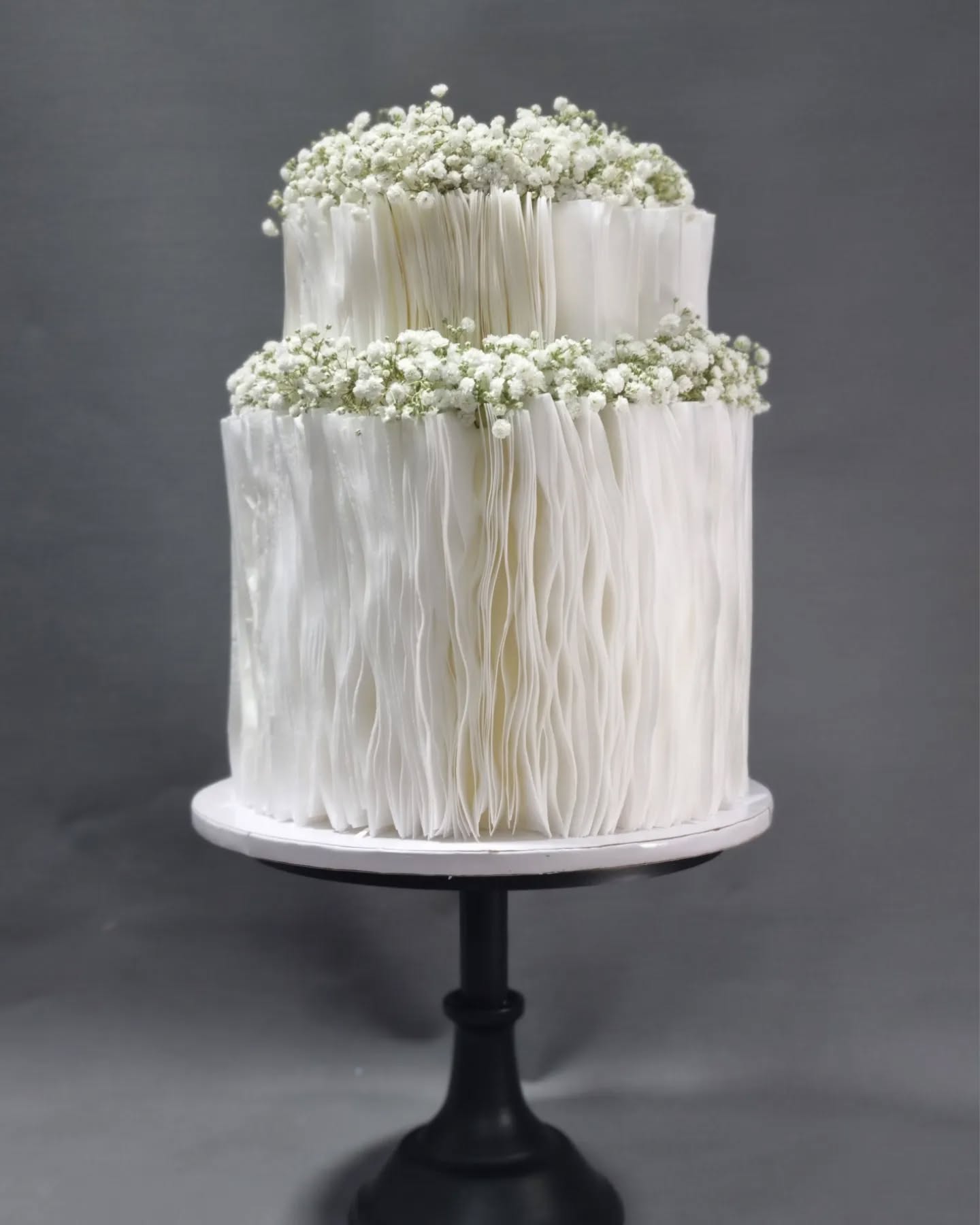 Two-tier White Cake with Textured Ruffle Design