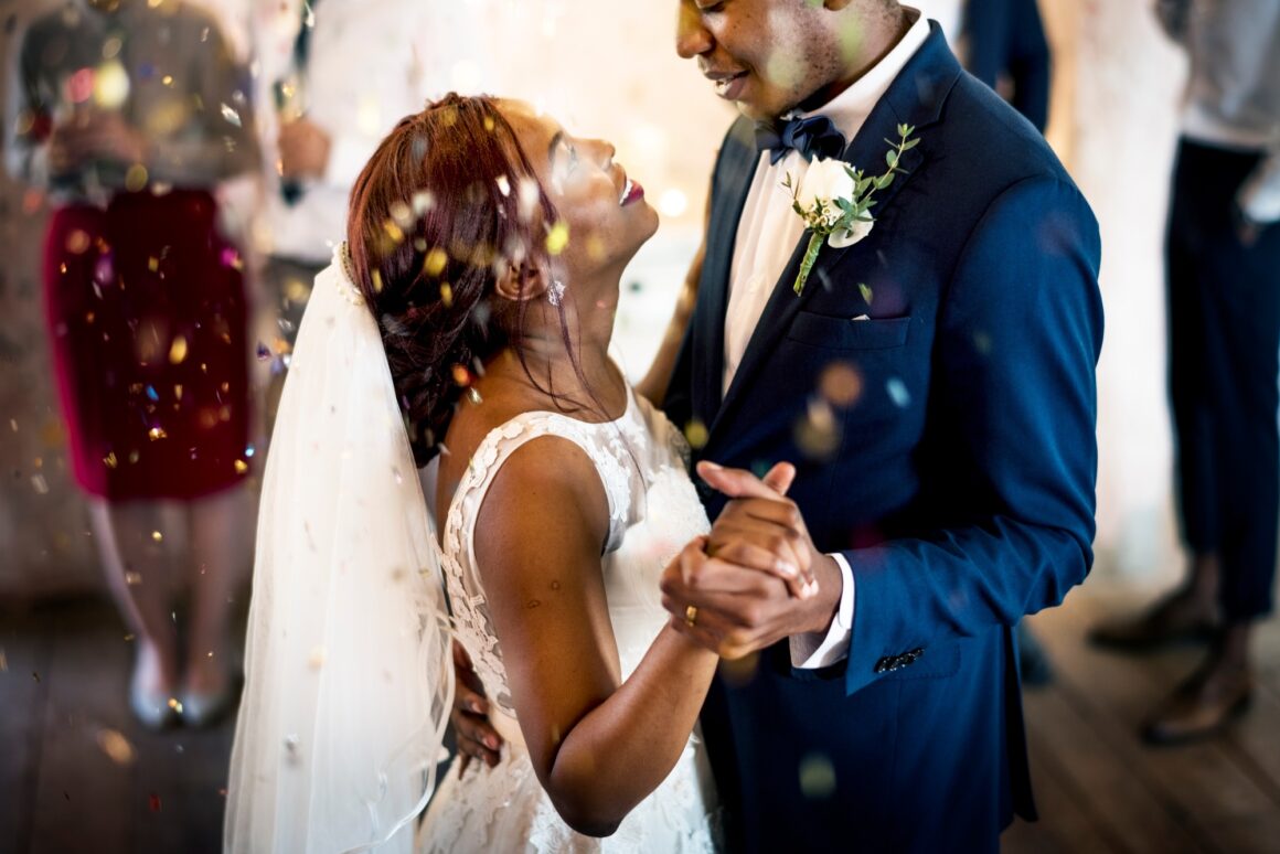 Newlywed African Descent Couple Dancing Wedding Celebration