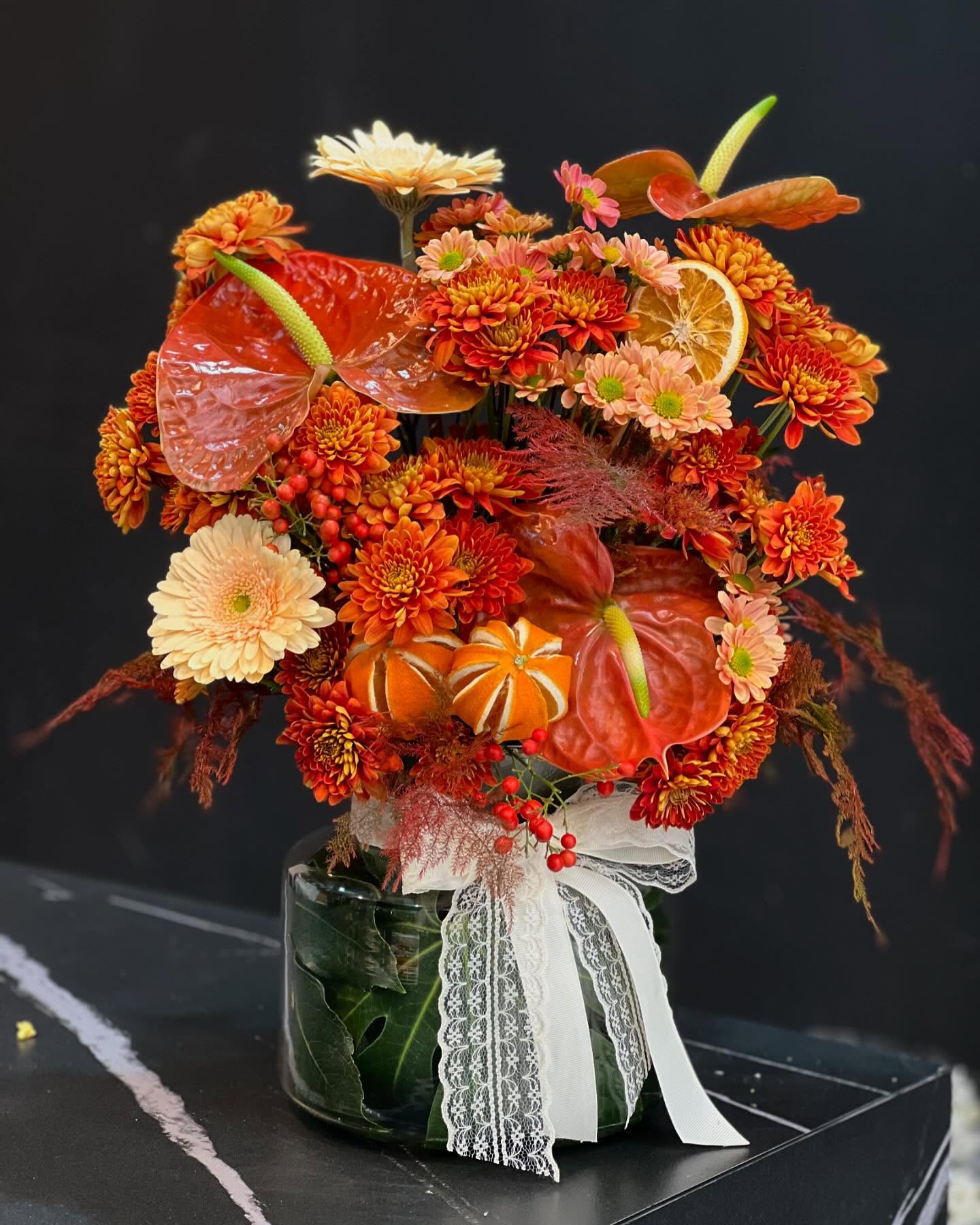 Orange Flower Arrangement With Dried Citrus