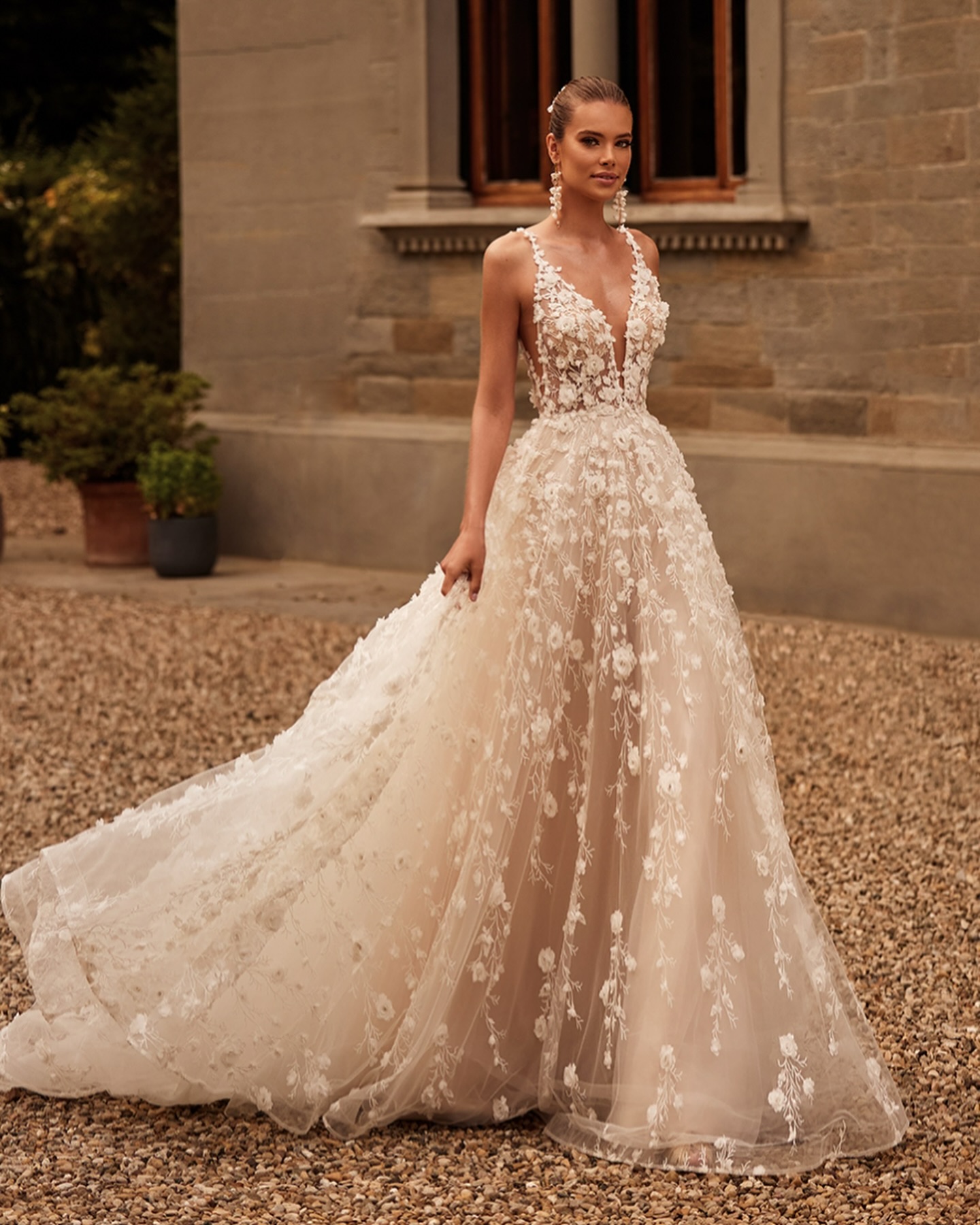 V-neckline dress with intricate 3D floral embellishments