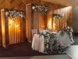 Dreamy Wedding Decor. Lavish floral decorations set against a rustic backdrop
