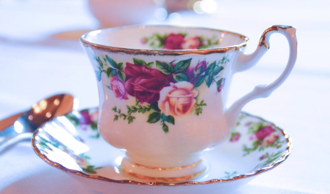 Vintage teacup and saucer with a rose pattern on a table at a restaurant