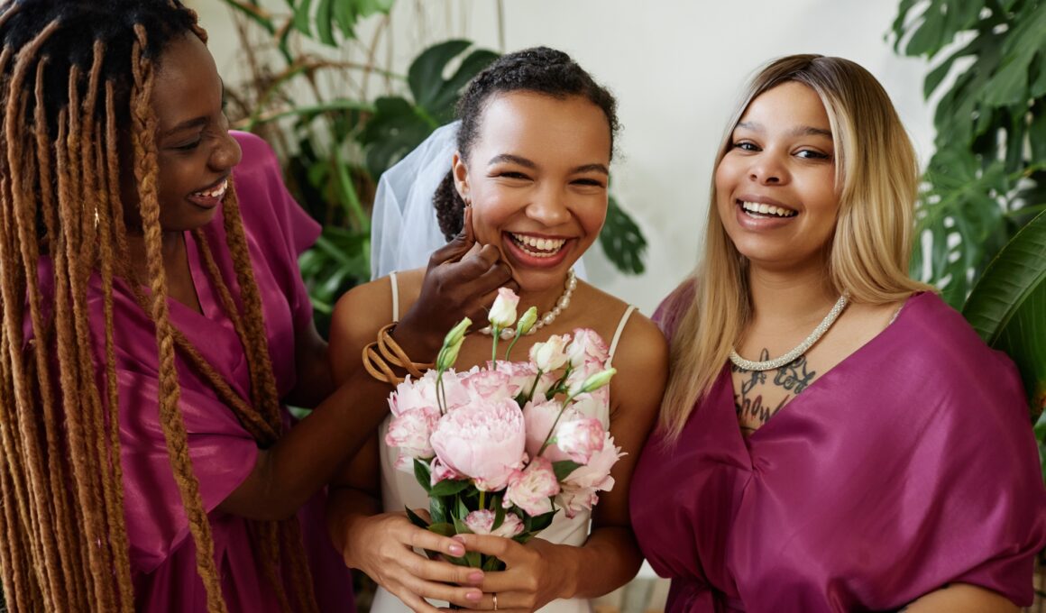Young bride having fun with bridesmaids during wedding party