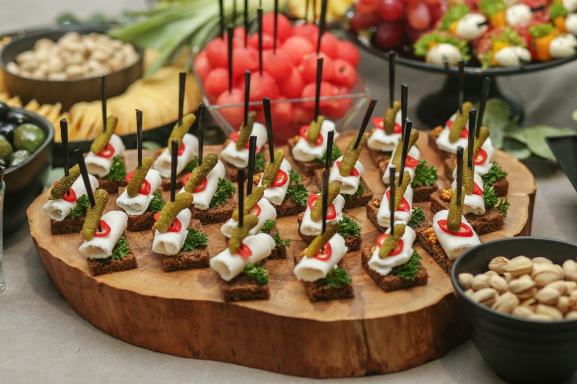 Appetizers made of lard, pickled cucumbers and brown bread stand. Wedding event