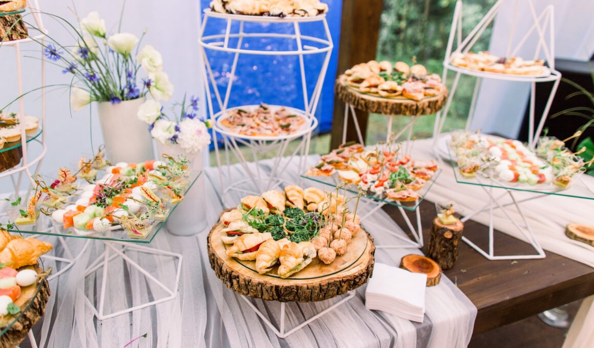 Catering buffet and rustic decor, outdoor wedding party with healthy food snacks