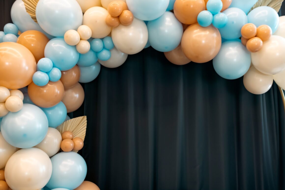 Balloons garland for little baby party on a blue background.