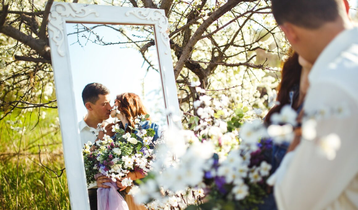 Beautiful loving couple in blooming gardens. Wedding concept. Great sunset light. Lovely newlyweds.