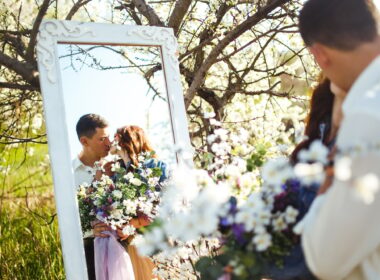 Beautiful loving couple in blooming gardens. Wedding concept. Great sunset light. Lovely newlyweds.