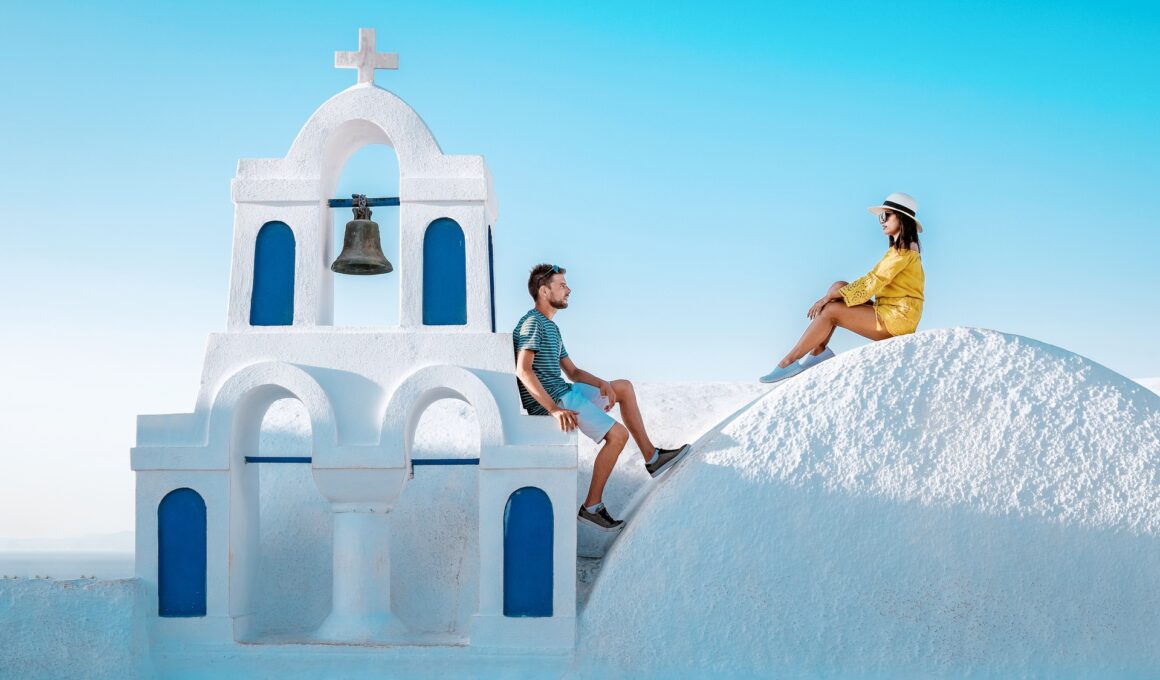 couple honeymoon on vacation Greece visisting Oia Santorini