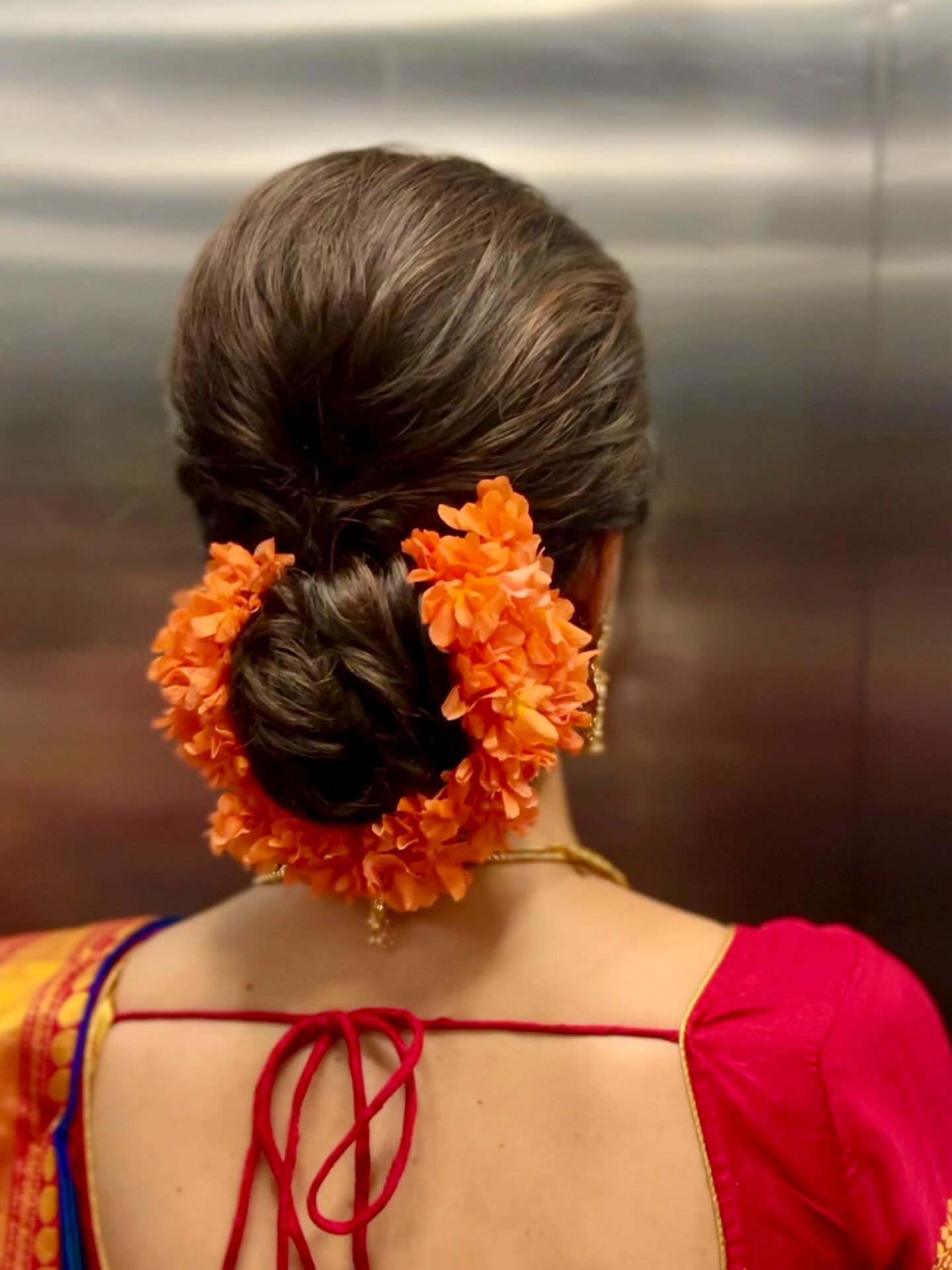 Twisted Bun with Orange Blooms