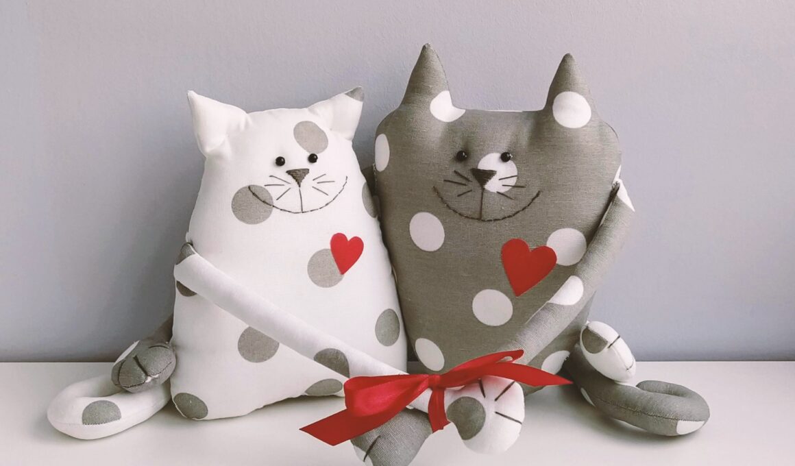 Interior soft toy two lovebird cats with red hearts. Handmade gift for Valentine's Day or Wedding