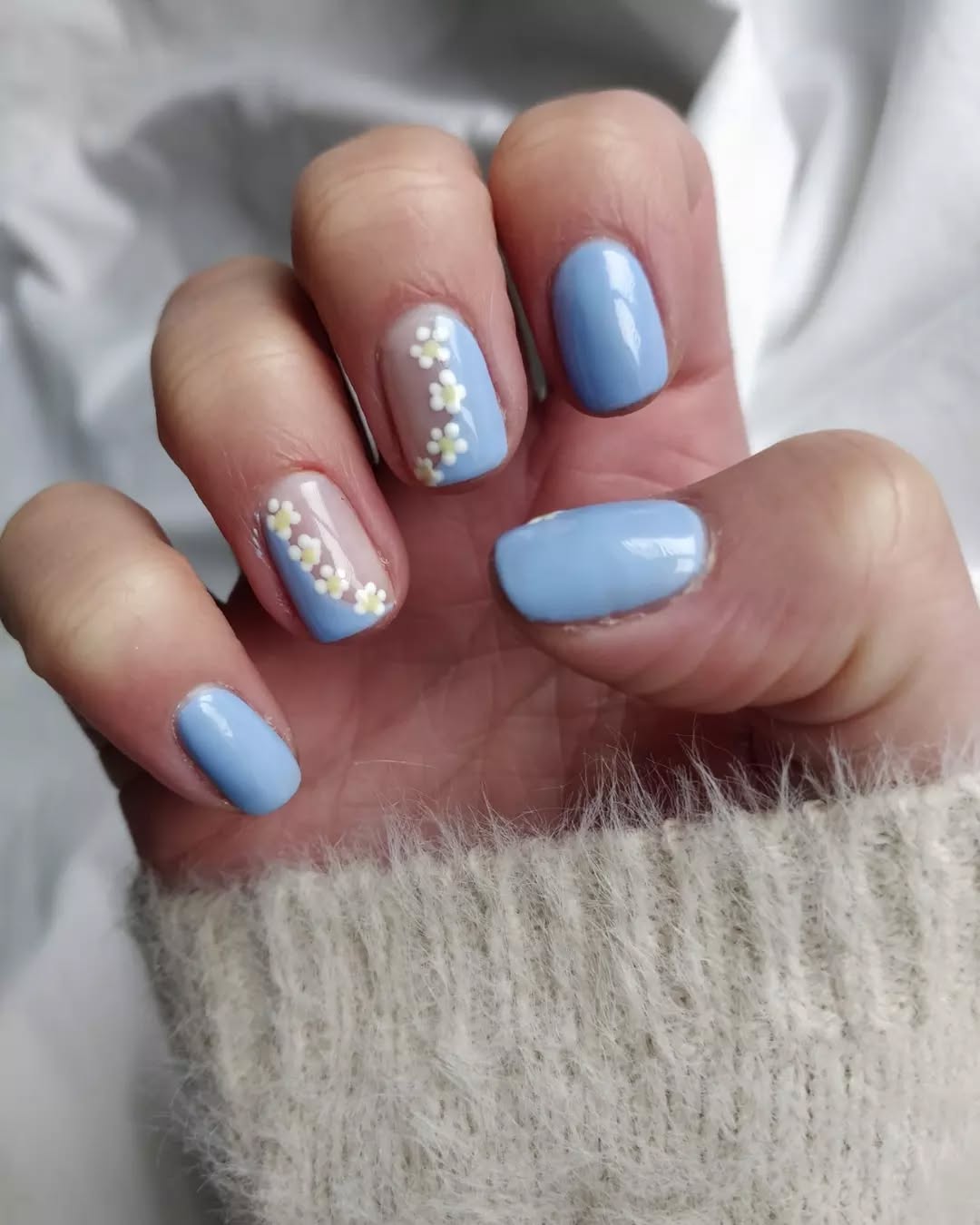 Pale Blue Nails with Daisy Chains