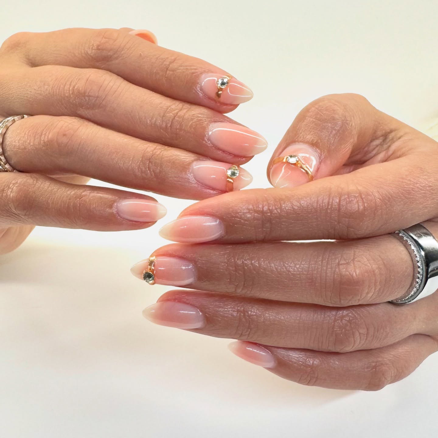 Blush Nails with Gold Jewelry
