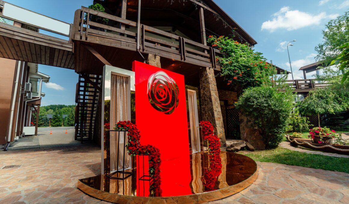 Wedding decor. the wedding ceremony area in the backyard is decorated with red roses flower