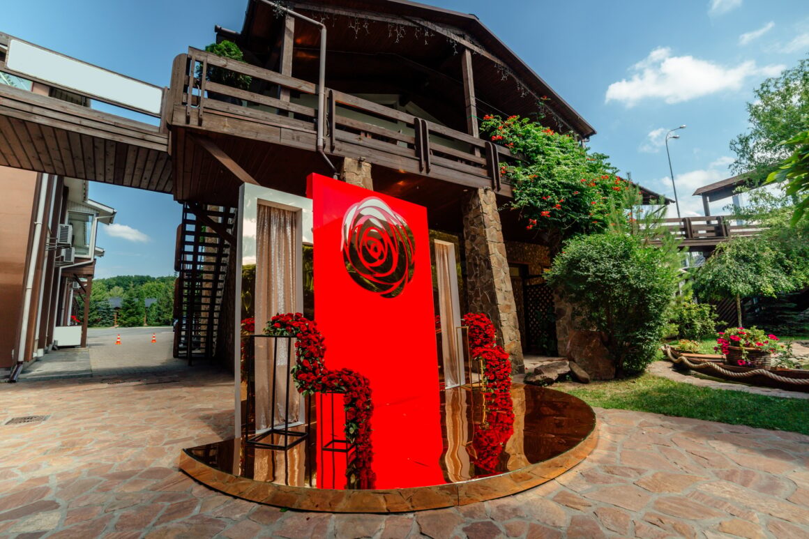 Wedding decor. the wedding ceremony area in the backyard is decorated with red roses flower