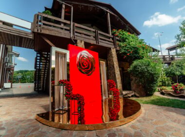 Wedding decor. the wedding ceremony area in the backyard is decorated with red roses flower