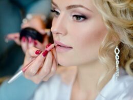 Wedding makeup artist making a make up for bride