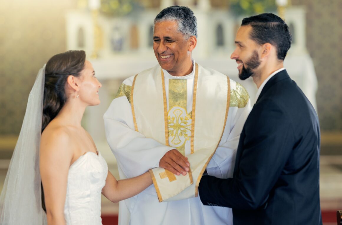 Wedding, priest and couple holding hands in church for a christian marriage oath and faithful commi