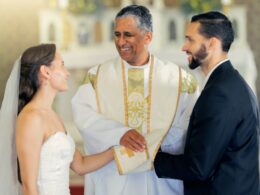 Wedding, priest and couple holding hands in church for a christian marriage oath and faithful commi