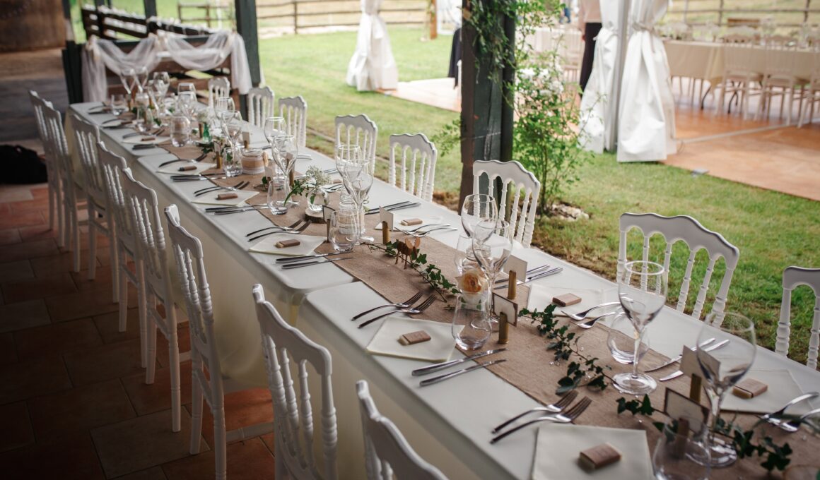 Outdoor catering dinner at the wedding with homemade garnishes decoration