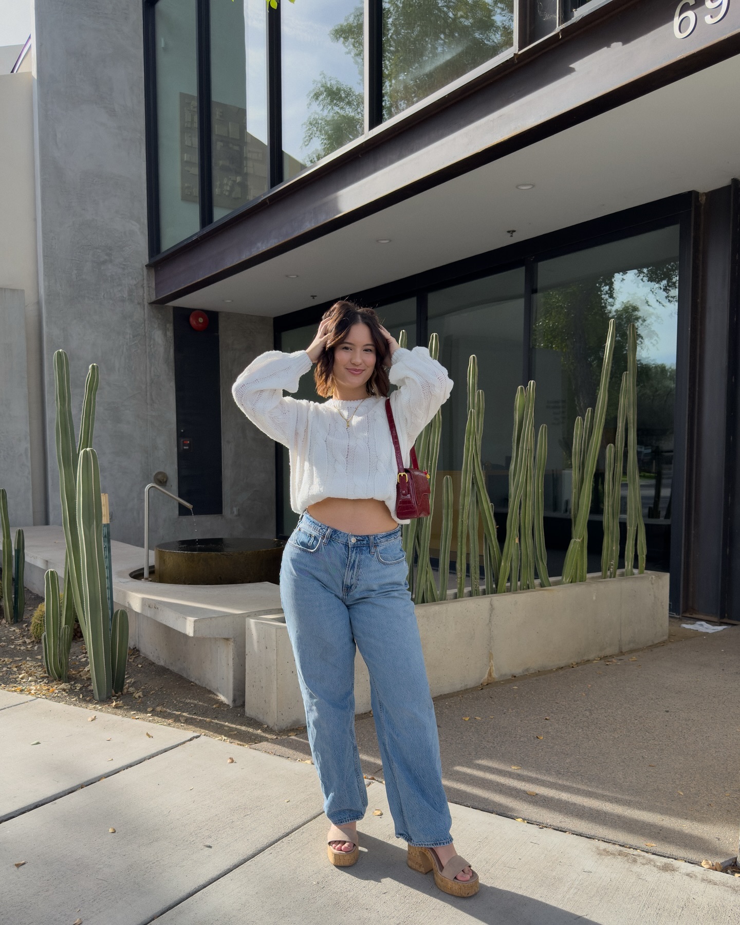 Boyfriend jeans with a crop sweater and wedge heels