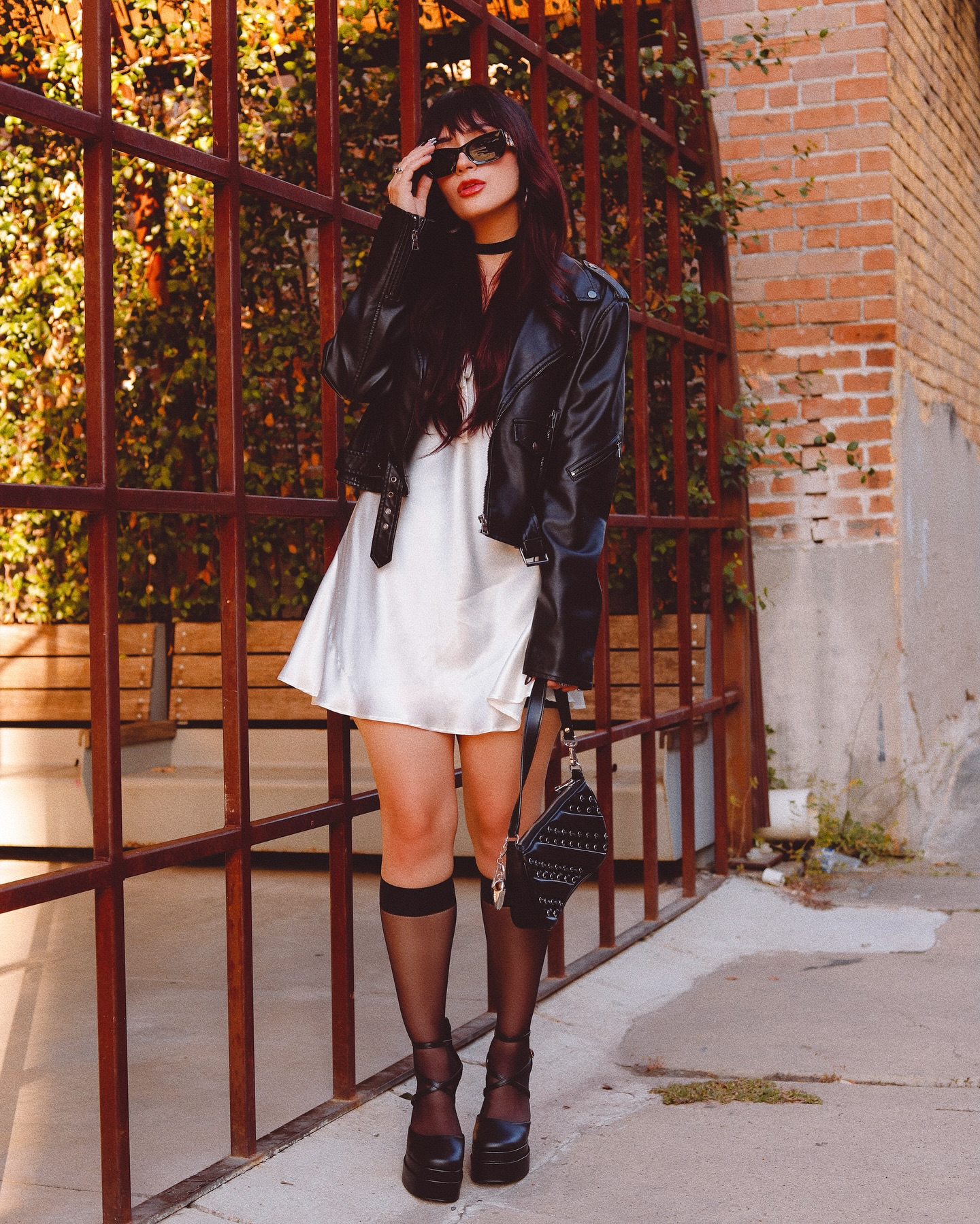 Satin dress with leather jacket