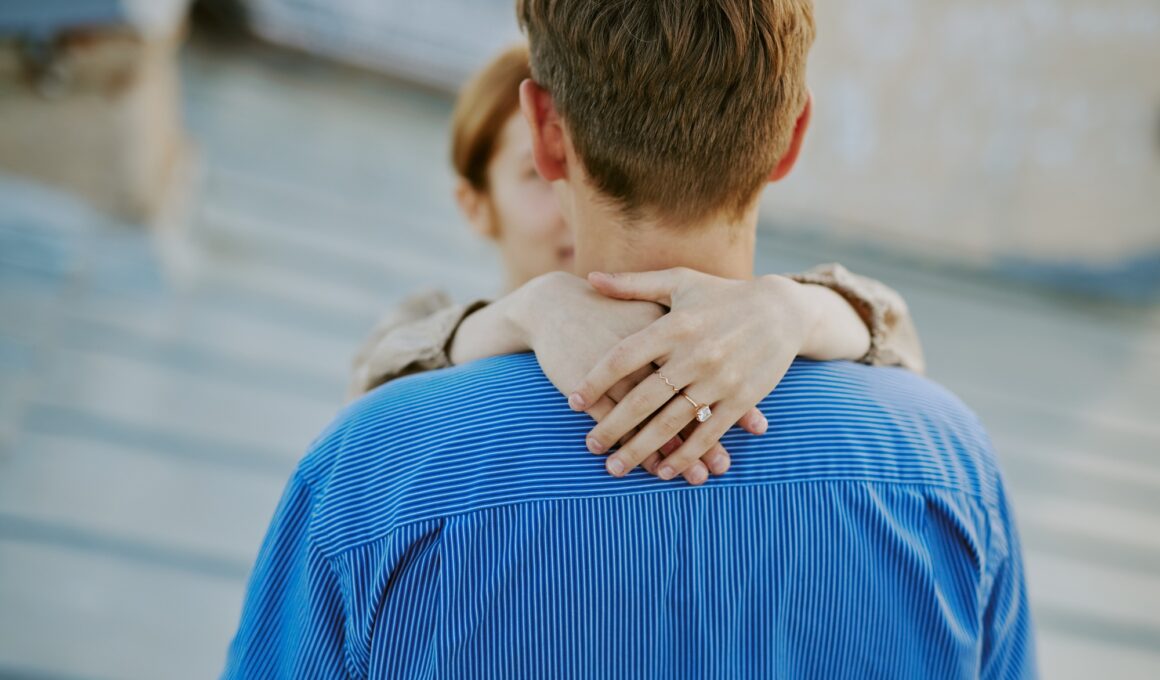 Couple Embracing with Emphasis on Engagement Ring