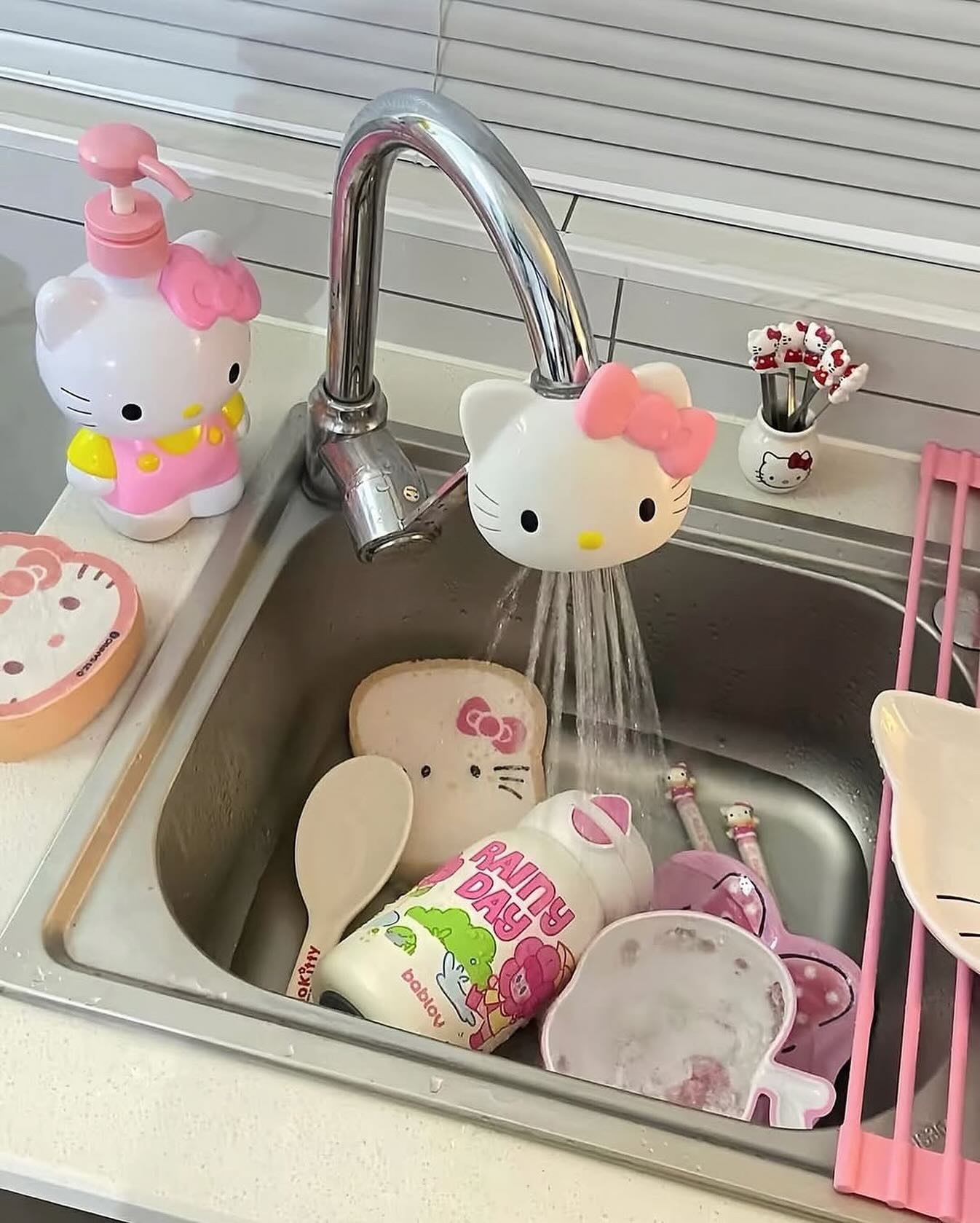 Pink sink with Hello Kitty faucet handles