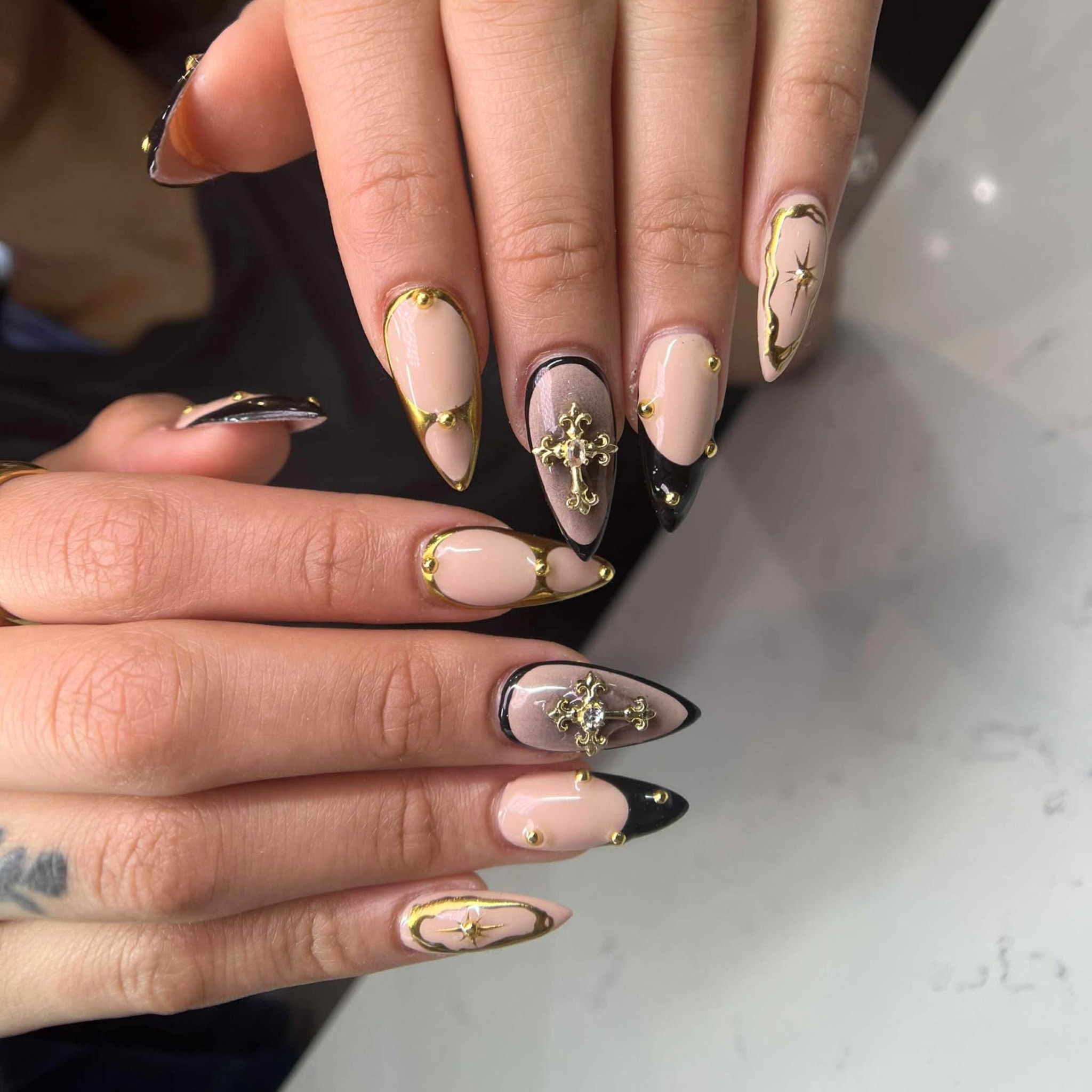 Black and Nude Stiletto Nails with Golden Accent 