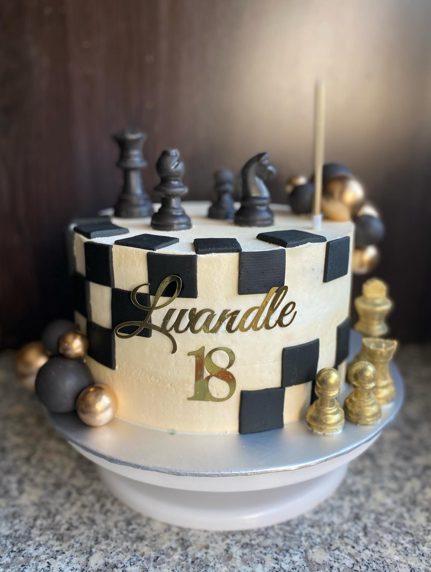 Gold and black checkerboard cake