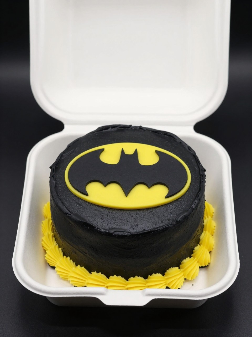 Image Prompt:
A Batman themed birthday bento cake in an open white cake box, smooth black frosting with yellow accents, large birthday number piped in the center, small Batman logo above the number, neat superhero styling, clean bakery presentation, realistic editorial dessert photography, no people, no hands, no faces, (no watermarks on images)
