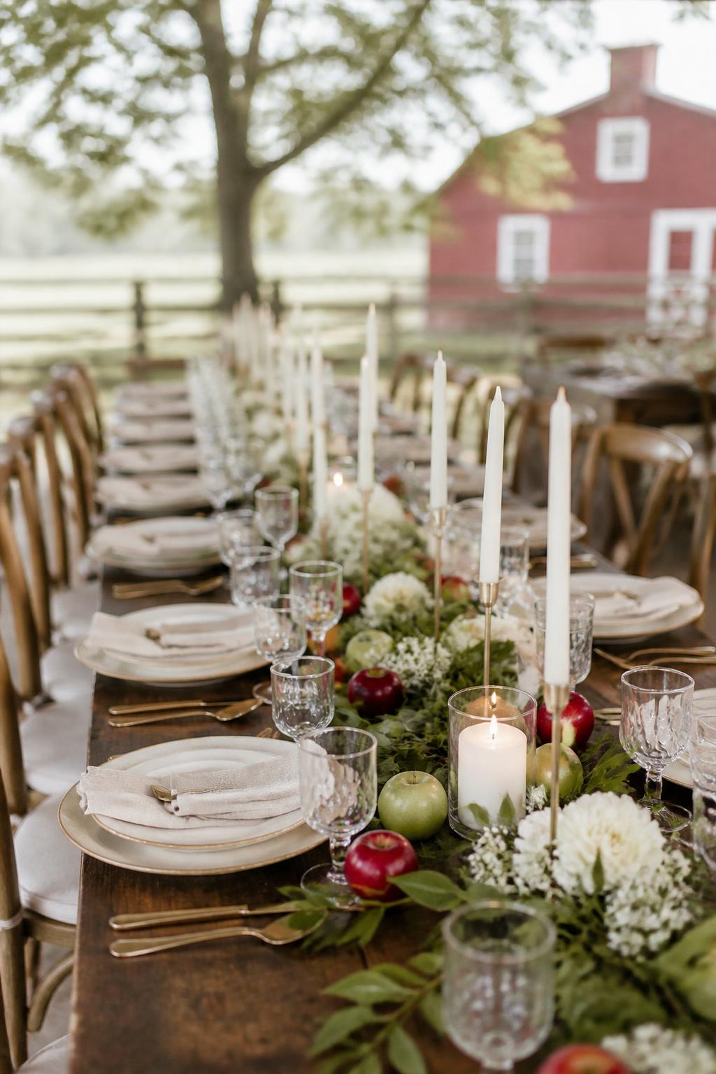Image Prompt:
A cute autumn wedding table styled with small red and green apples placed lightly along a greenery runner, white flowers, ivory candles, ceramic plates, linen napkins, and clear glasses. Orchard, barn, or garden fall wedding reception setting with soft natural light, no visible faces, no text, no watermark, realistic editorial photography, (no watermarks on images)