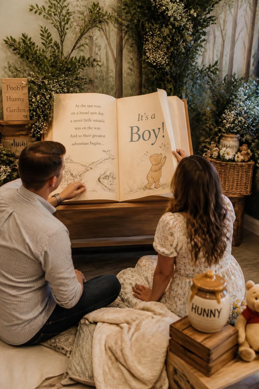 A realistic editorial photo of a cozy Winnie the Pooh-inspired gender reveal reading corner, not Disney style, oversized storybook prop on a wooden stand, soft blankets, honey jars, woodland flowers, parents turning the final page to reveal the baby message, warm indoor lighting, nostalgic storybook atmosphere