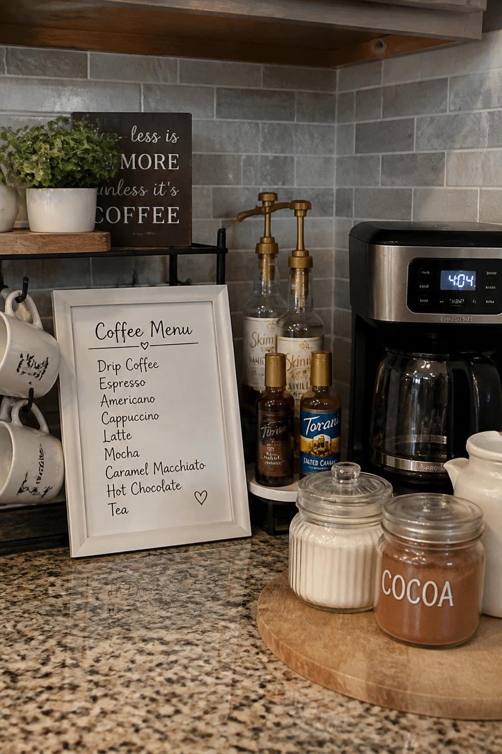 A realistic DSLR photo of a cozy home coffee bar with a small framed coffee menu sign leaning against the backsplash, white frame with handwritten-style drink names, compact coffee maker, mugs on hooks, glass jars of sugar and cocoa, small tray of syrups, warm kitchen light, realistic budget DIY styling, no people.