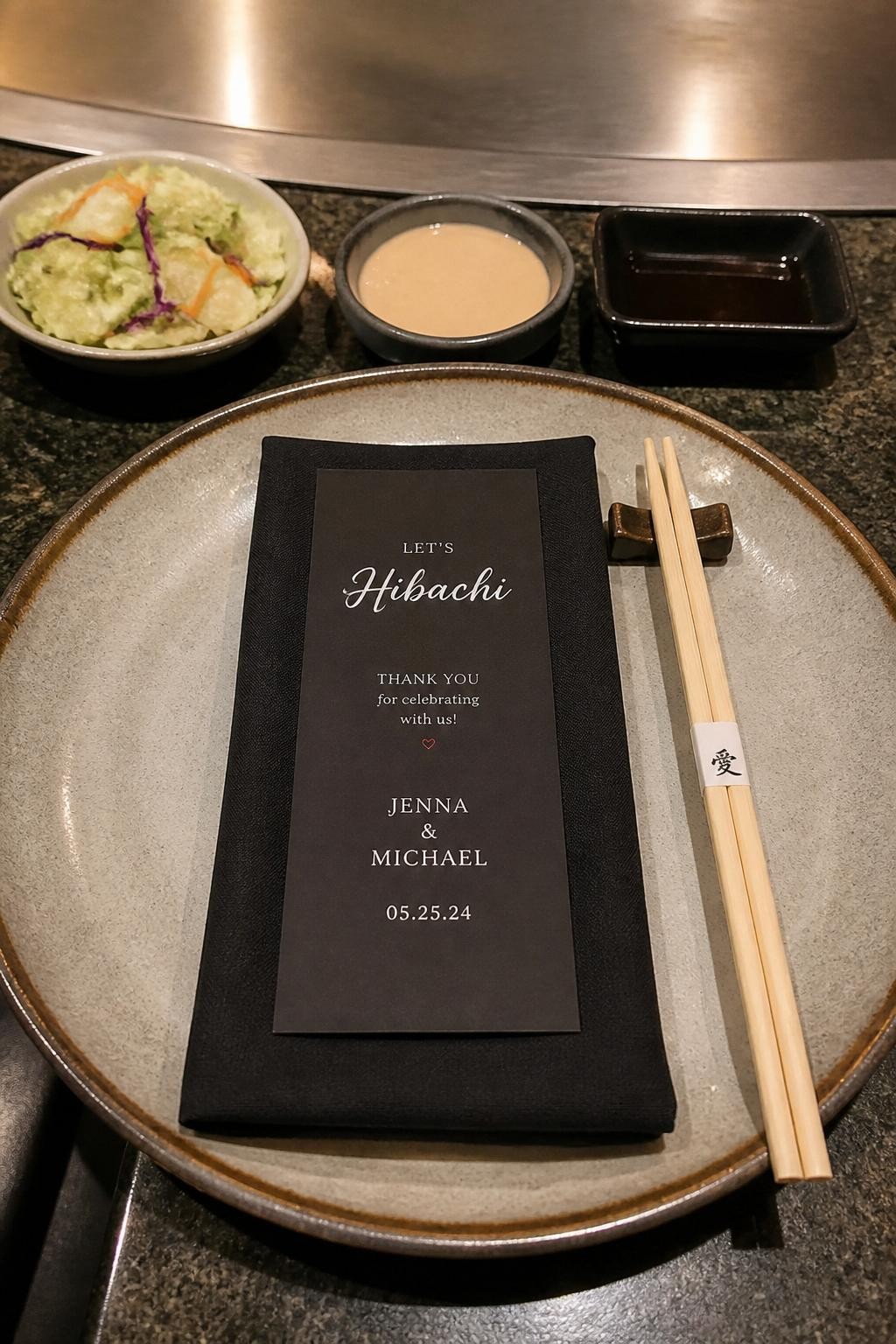 Image Prompt:
A realistic DSLR close-up photo of a hibachi party place setting with a ceramic plate, chopsticks, folded napkin, personalized mini menu card, small dipping bowls, and textured tabletop details, no people, refined editorial tablescape photography.