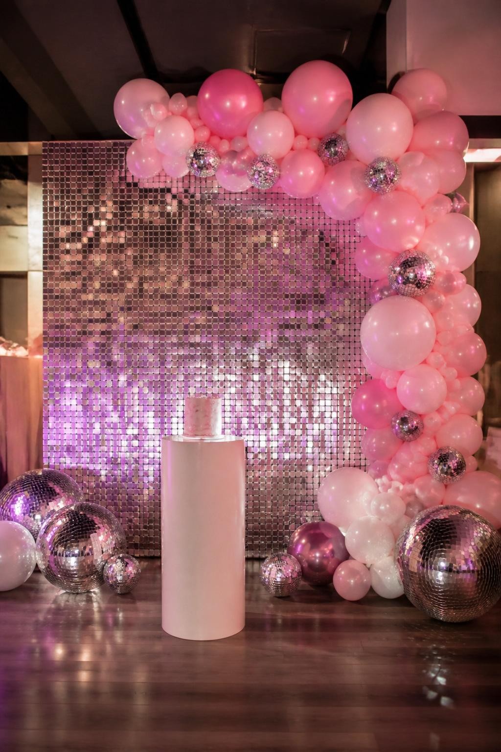 Image Prompt:
A single realistic photo of a dreamy Sweet 16 backdrop with a pale blush panel, delicate butterfly cutouts in pink, ivory, and soft gold arranged in a floating pattern, blush and white balloon clusters, soft floral accents, a gold number 16 prop, bright indoor party setting, no people, no faces, soft natural lighting, realistic editorial event photography, no text, no watermark.